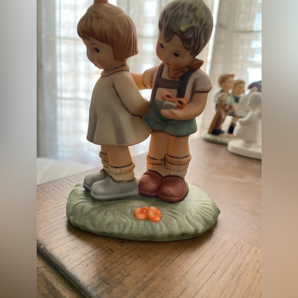 Hummel Figurine with Brown and Green Accents